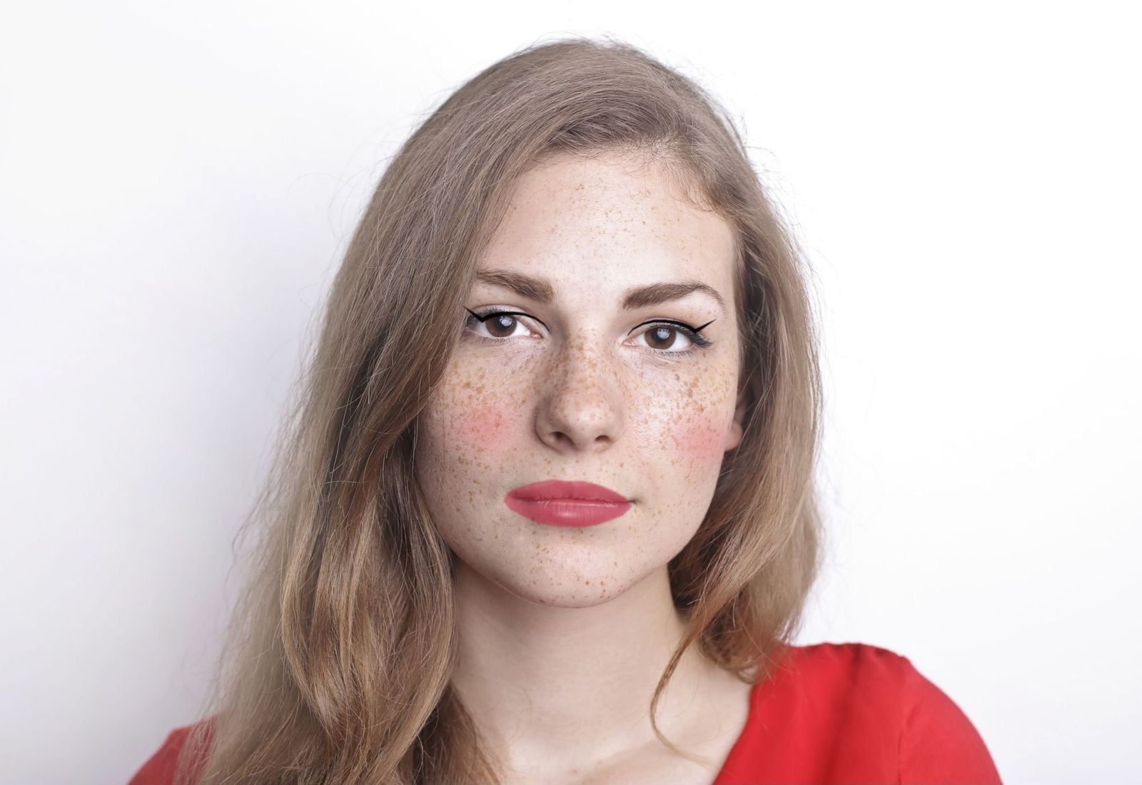 Stock portrait with soft blush, winged liner and lip gloss